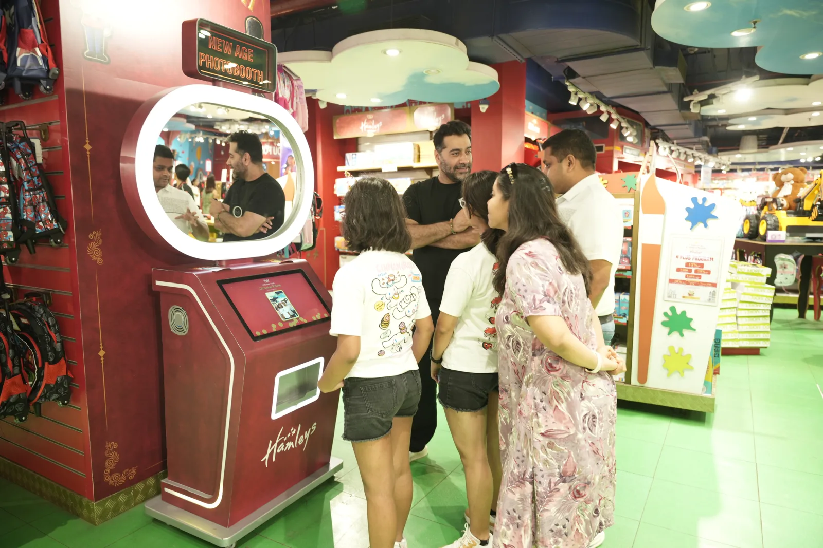 Customers around the red Pikcha booth built for Hamleys