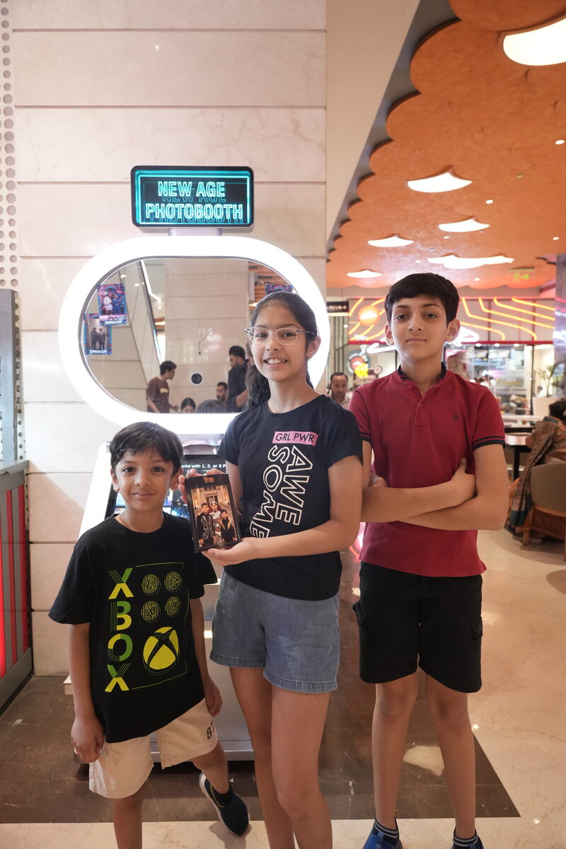 Guests using Pikcha AI Photo Booth at activation