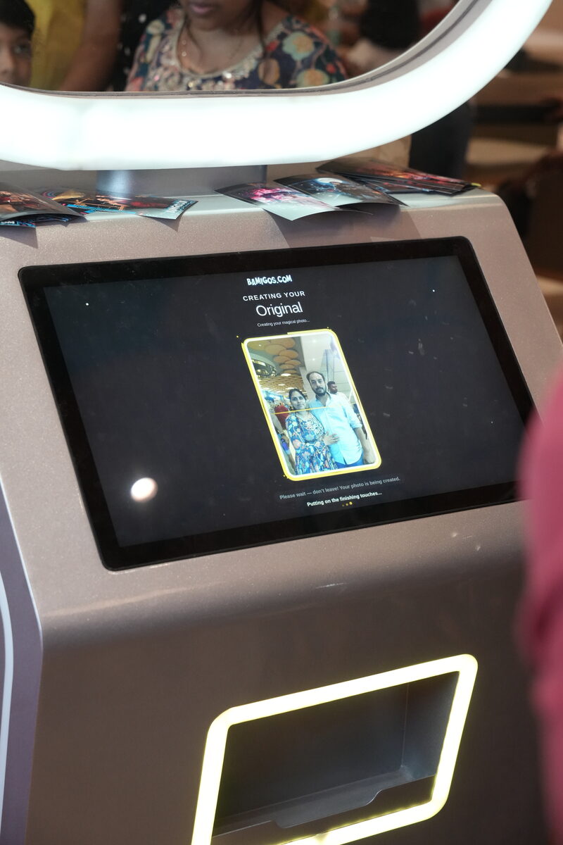 Customer interacting with Pikcha touchscreen